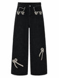 Jeweled washed-black jeans on pure white